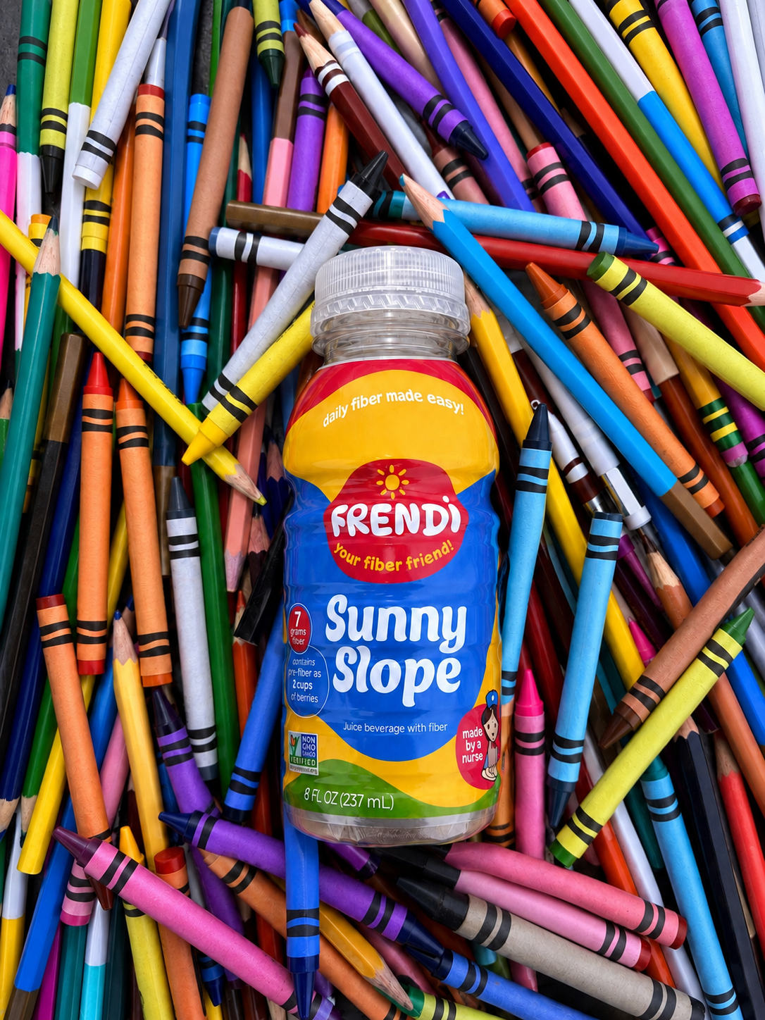 Frendi Sunny Slope bottle surrounded by colorful crayons