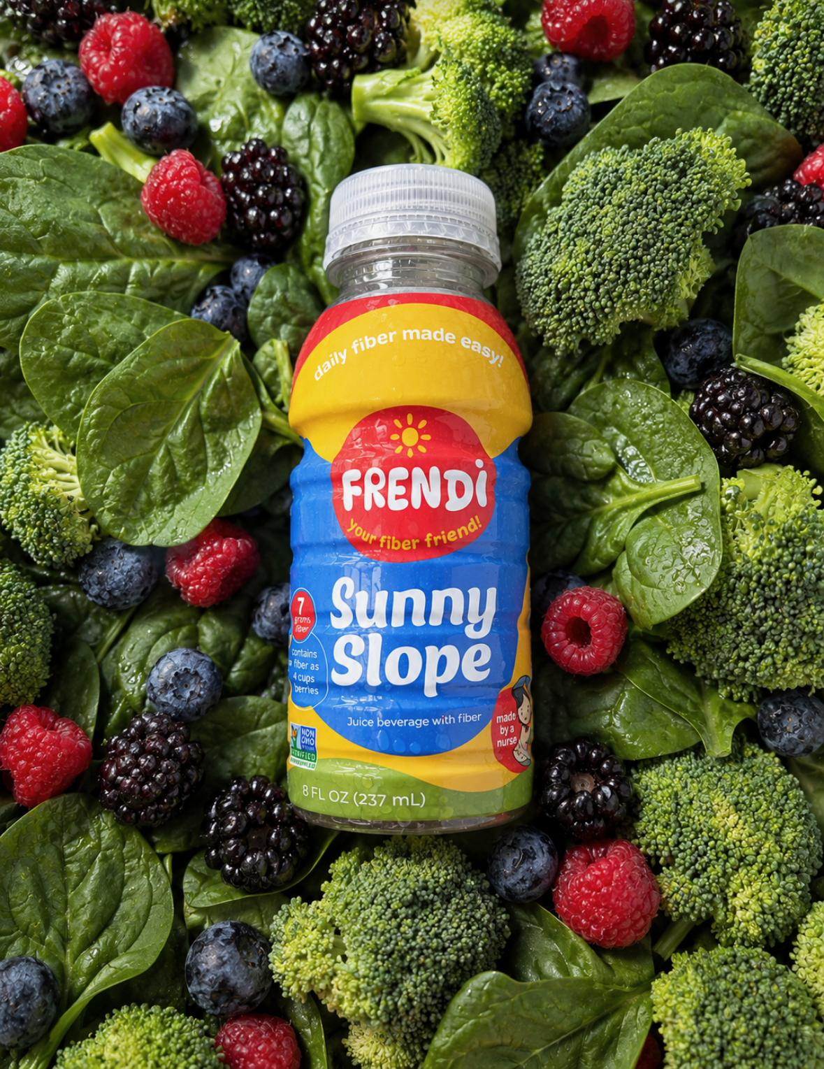 Frendi Sunny Slope bottle surrounded by berries, spinach, and broccoli